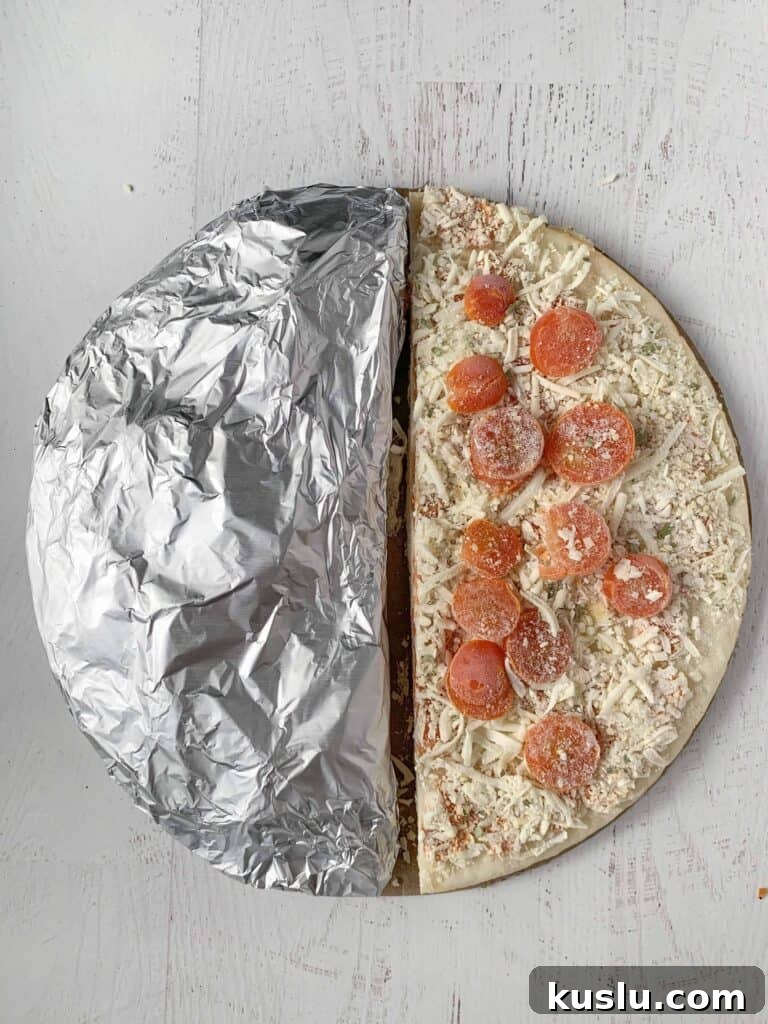 Gluten-Free on a Budget: 10 Smart Ways to Save Money 7 A frozen margarita pizza cut in half, half is wrapped in foil.