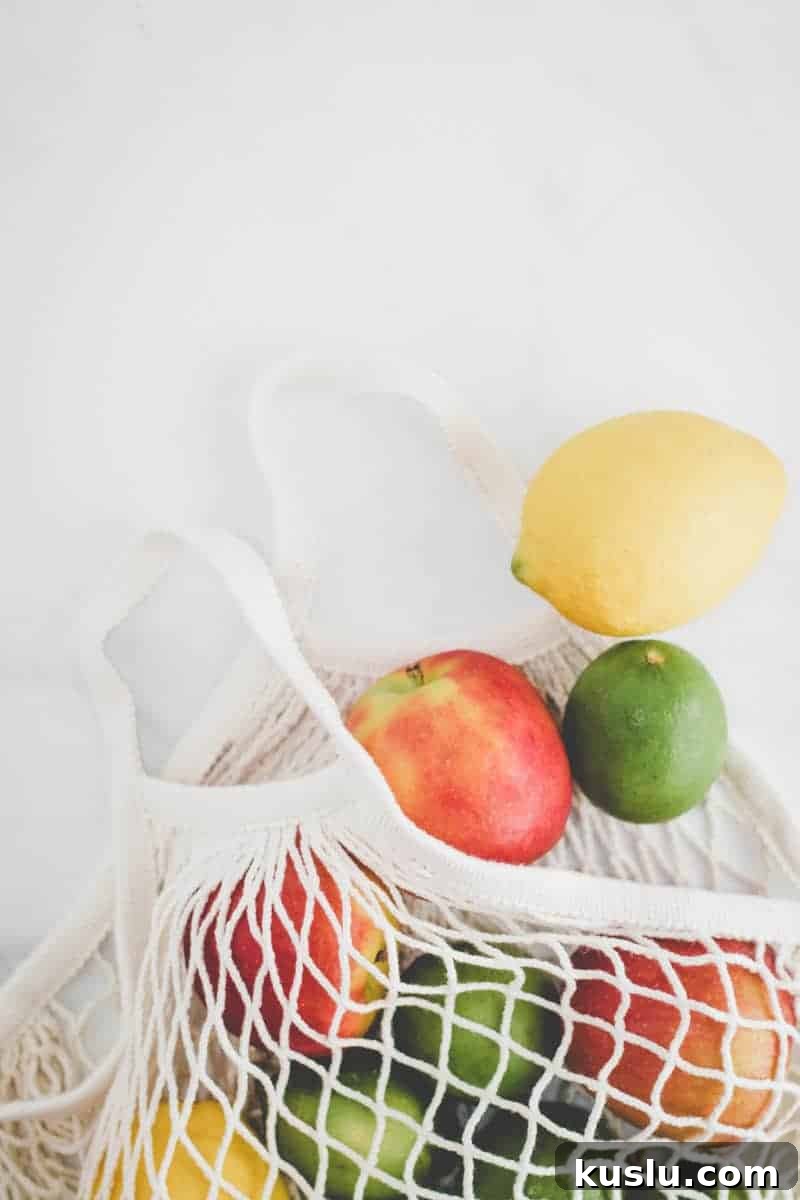Gluten-Free on a Budget: 10 Smart Ways to Save Money 9 Ikea KUNGSFORS mesh produce bag with apples, lemons, and limes spilling out.