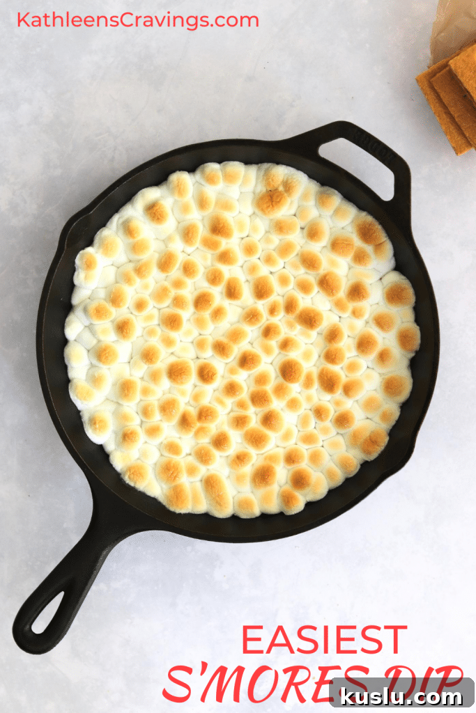 Baked S'mores dip in skillet with text overlay