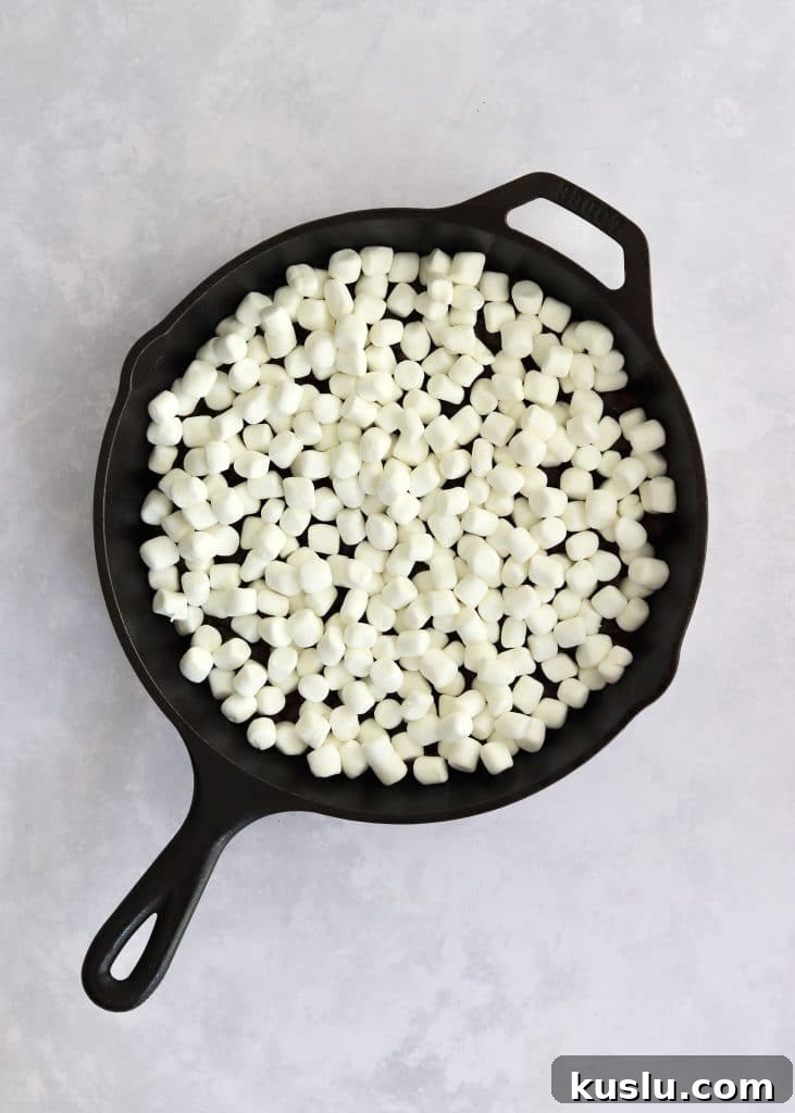 Unbaked s'mores dip in cast iron skillet