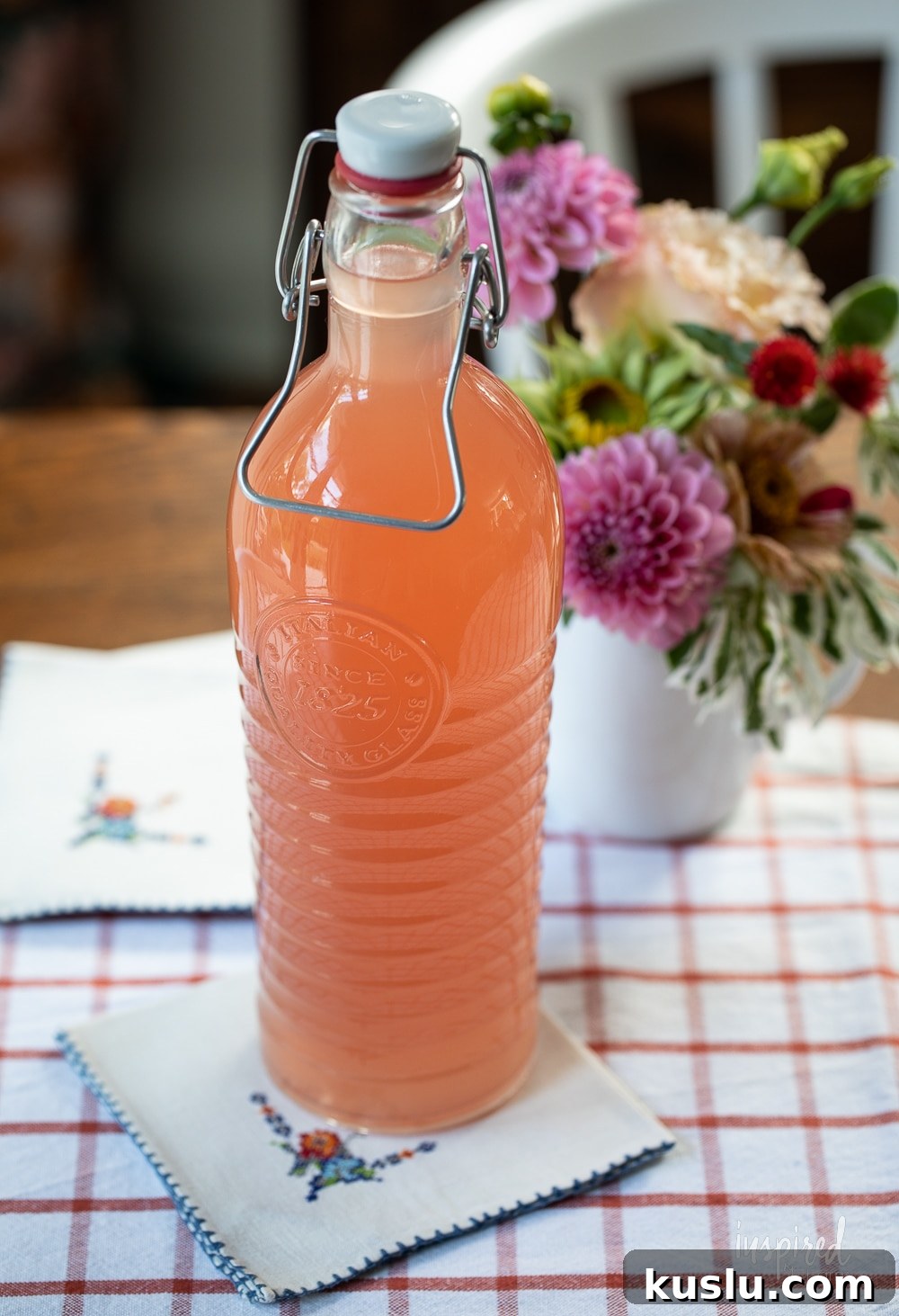 Homemade Rhubarb and Ginger Infused Vodka Recipe 4 homemade rhubarb ginger vodka in a glass bottle.