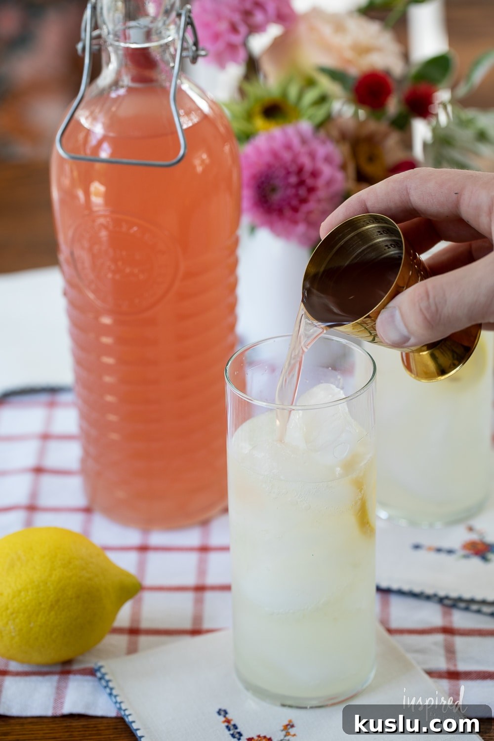 Homemade Rhubarb and Ginger Infused Vodka Recipe 9 adding a shot of homemade rhubarb ginger vodka into lemonade.