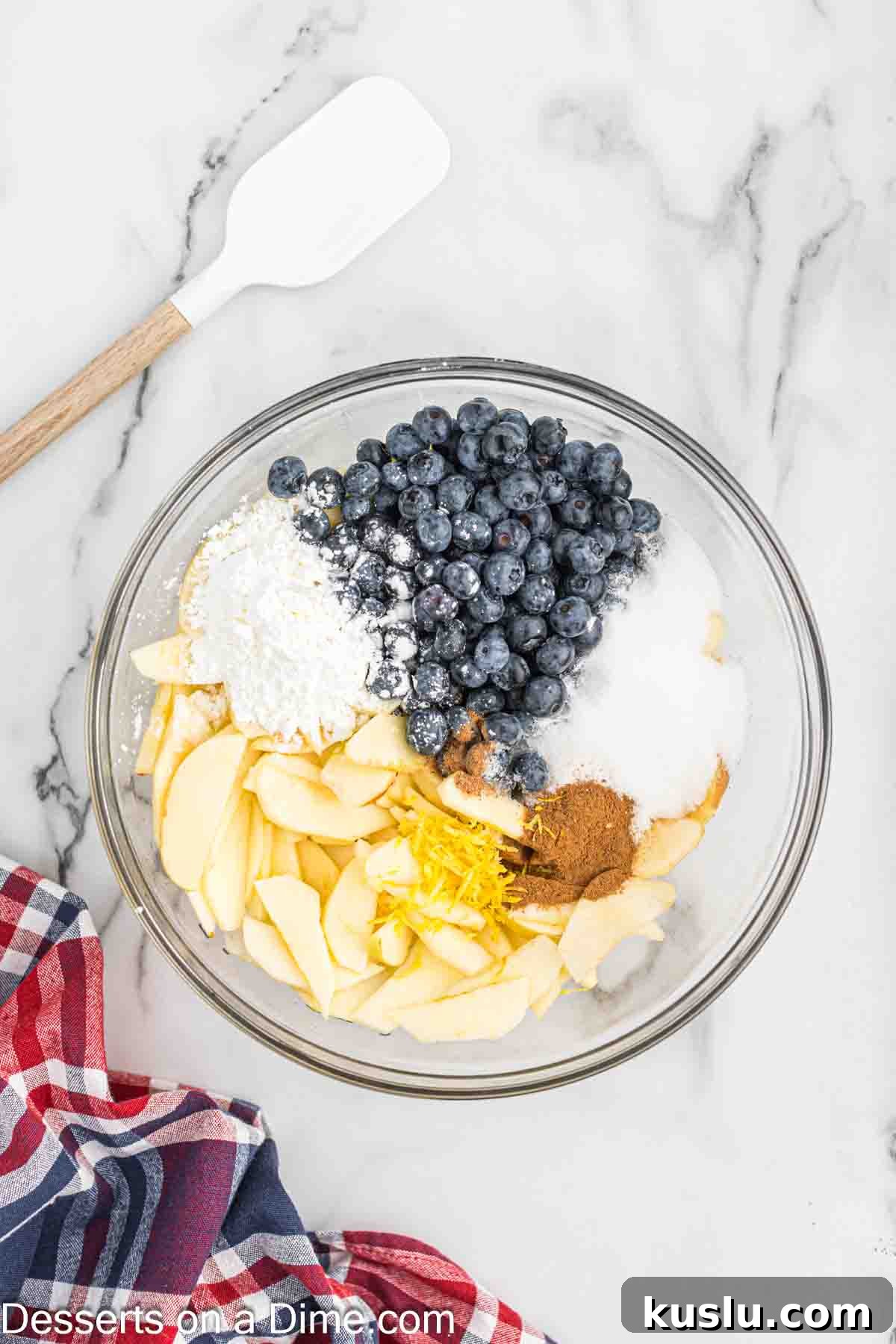 Apple and Blueberry Pie Recipe: Flaky Crust with Fresh Fruit Filling 4 Mixing bowl with blueberries, apples and sugar combined.