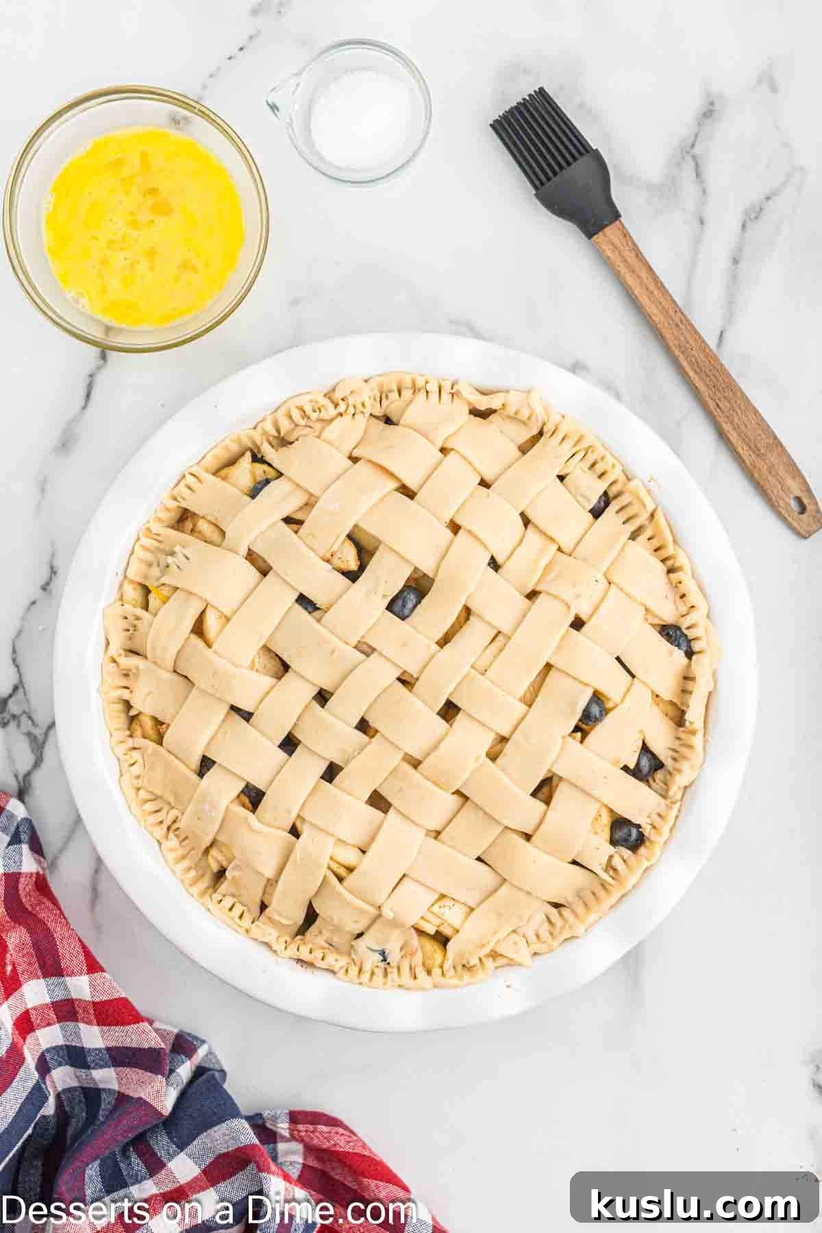 Apple and Blueberry Pie Recipe: Flaky Crust with Fresh Fruit Filling 6 Lattice on pie crust topped with egg wash.