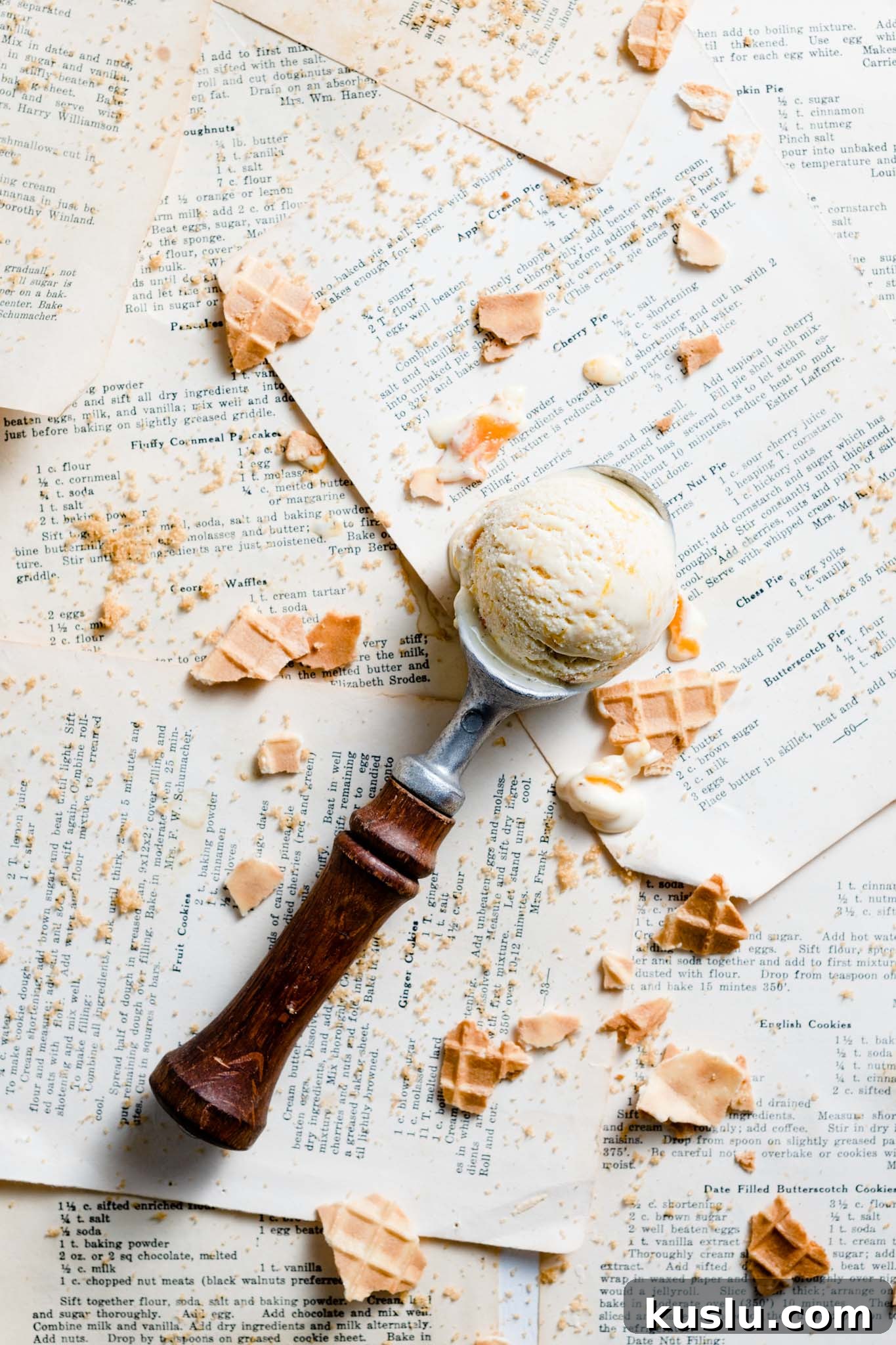 Creamy Homemade Peach Ice Cream Recipe for Summer 11 Ice cream scoop with peach ice cream.