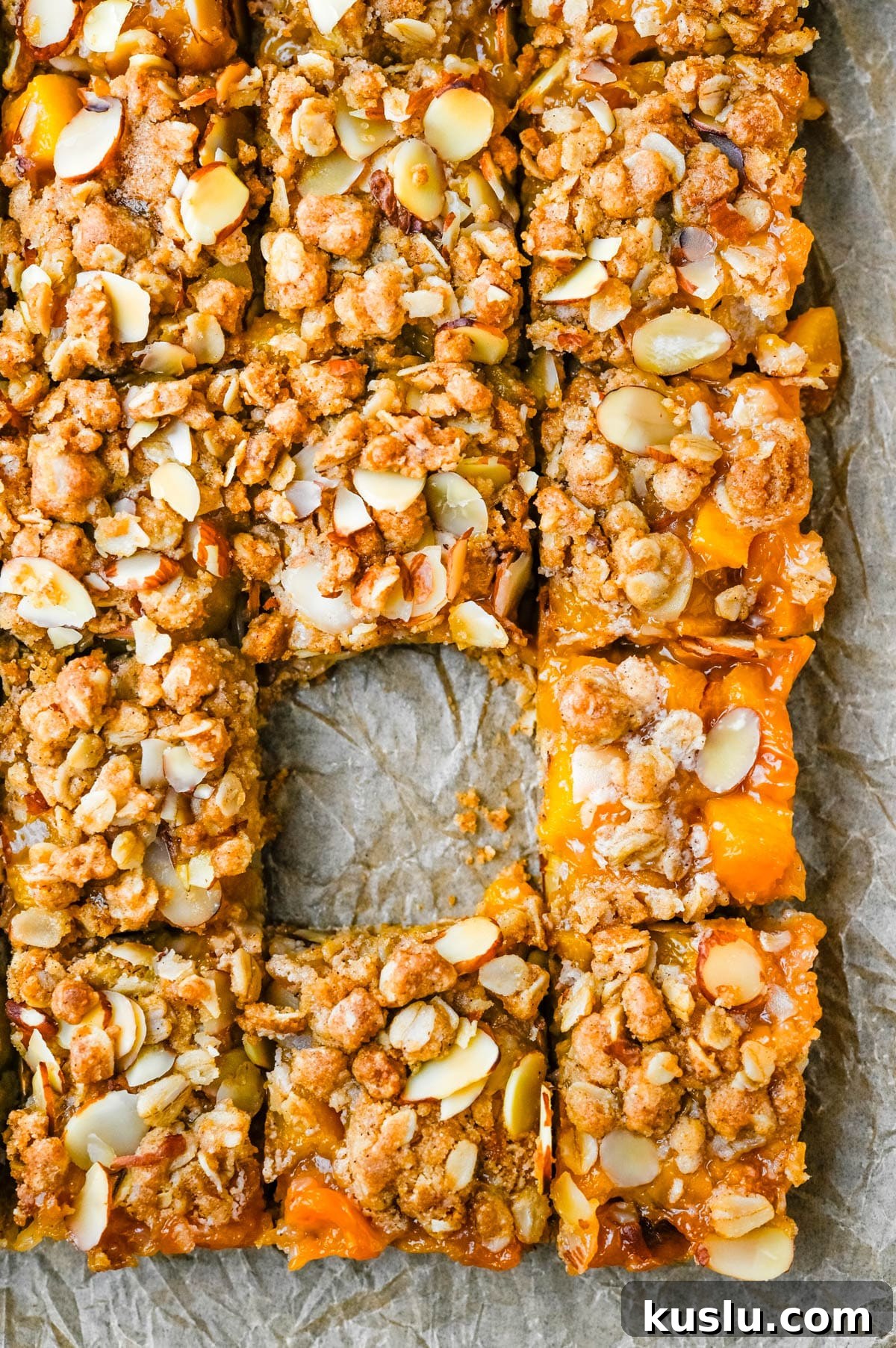 Slicing the peach bars into squares.