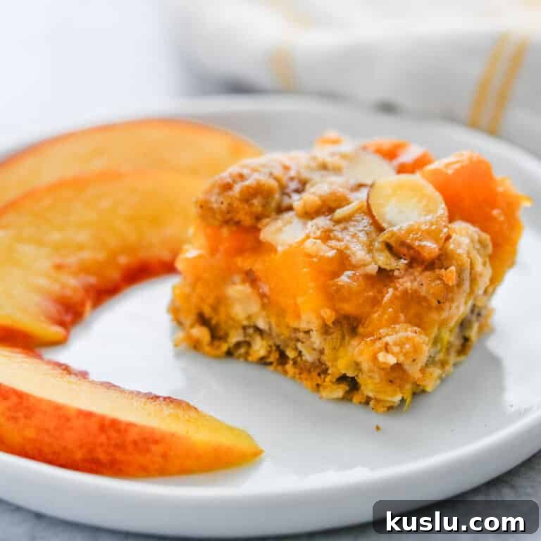 Fresh Peach bars on a plate with sliced peaches.
