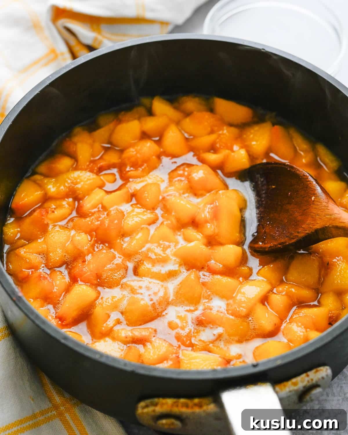 I am cooking chopped peaches in a saucepan with sugar and cornstarch slurry.