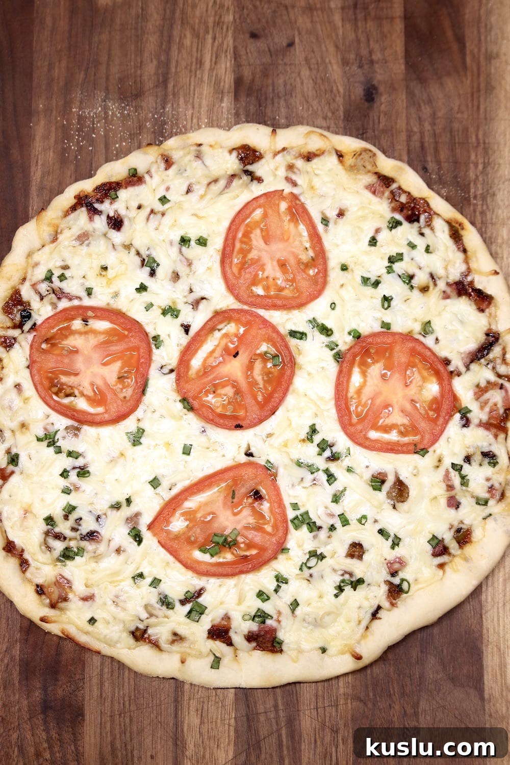 Brisket Pizza Brisket pizza topped with sliced tomatoes