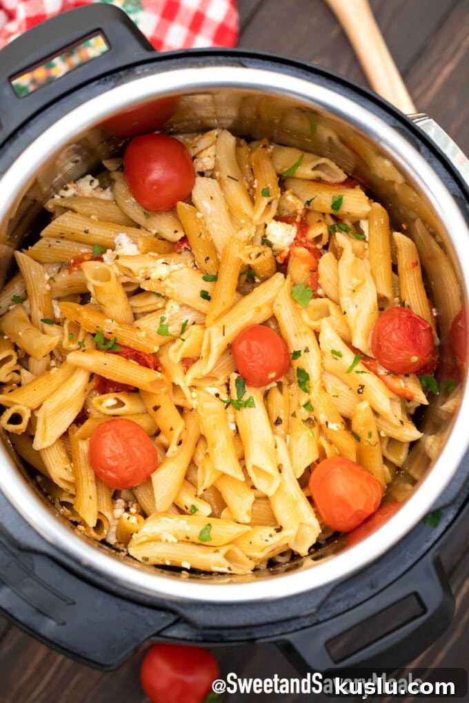 Instant Pot Tik Tok feta pasta with penne noodles and cherry tomatoes.