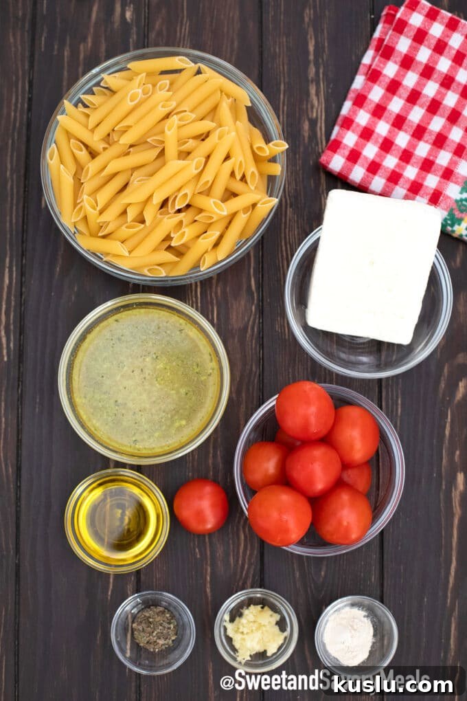 Instant Pot feta pasta arranged in bowls on a wooden table.