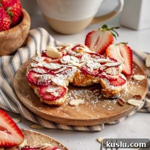 Strawberry Almond Bostock Made from Croissant Pastry 10 Strawberry almond bostock pastry on a plate.