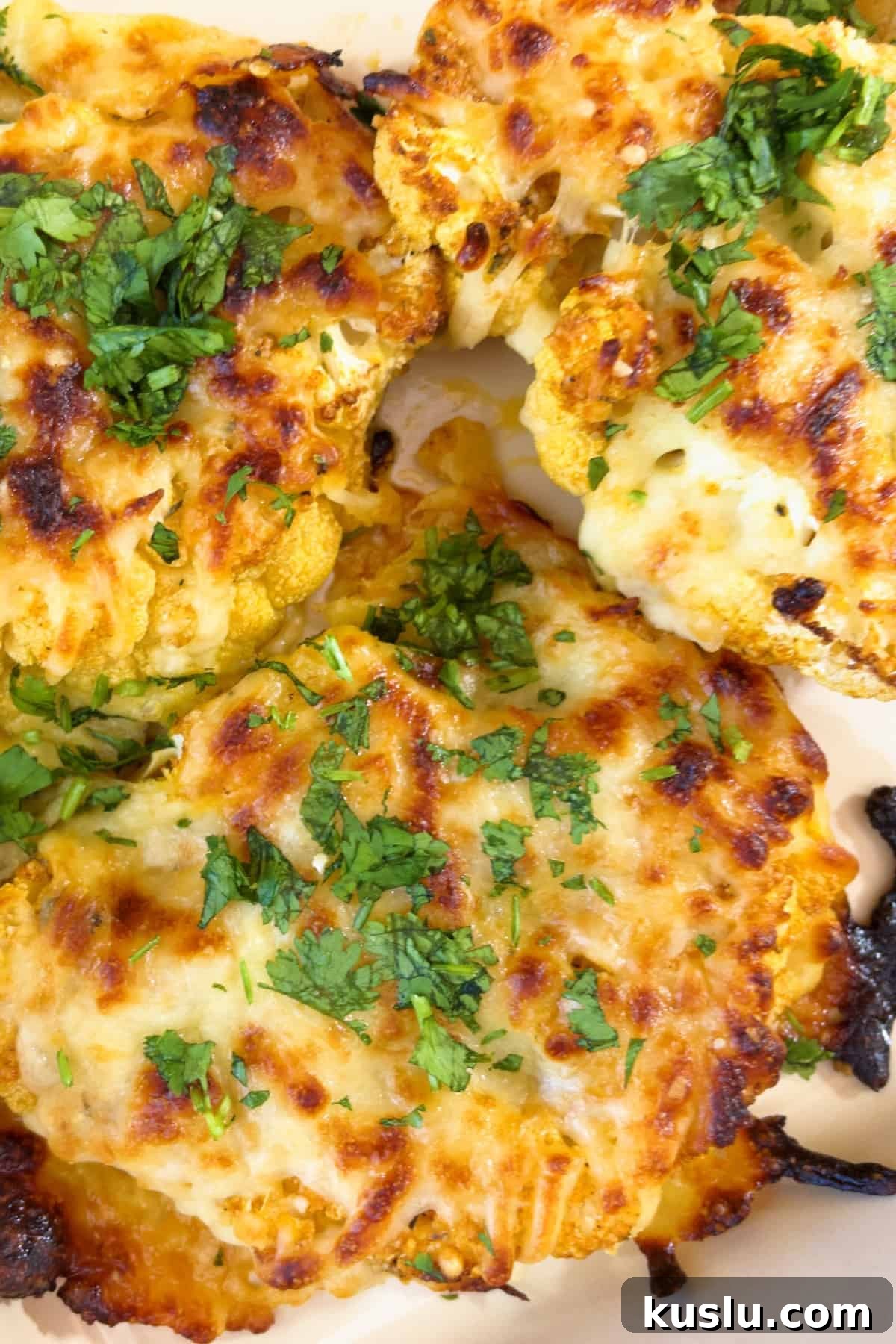 Finished and ready to eat cheesy cauliflower steaks.