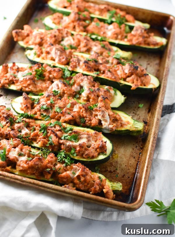 Italian Chicken Zucchini Boats Recipe — Savory Stuffed Zucchini 2 Chicken zucchini boats topped with melted cheese and herbs