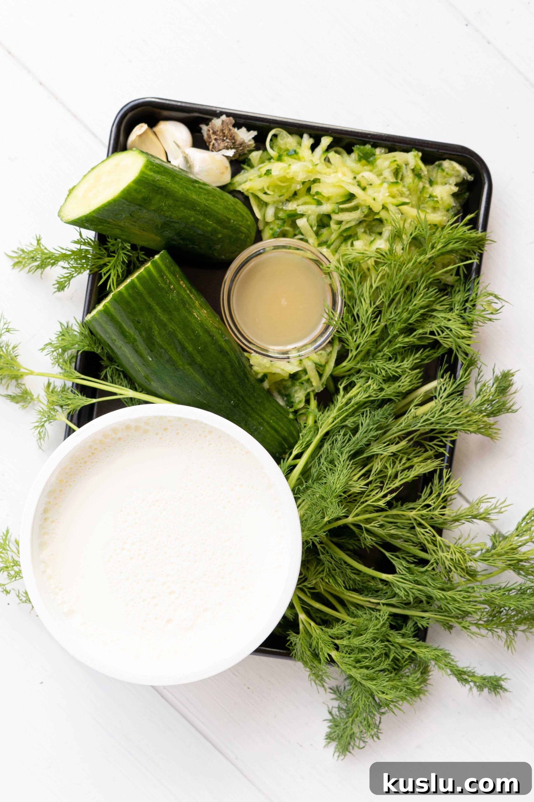 All the ingredients needed to make tzatziki sauce.