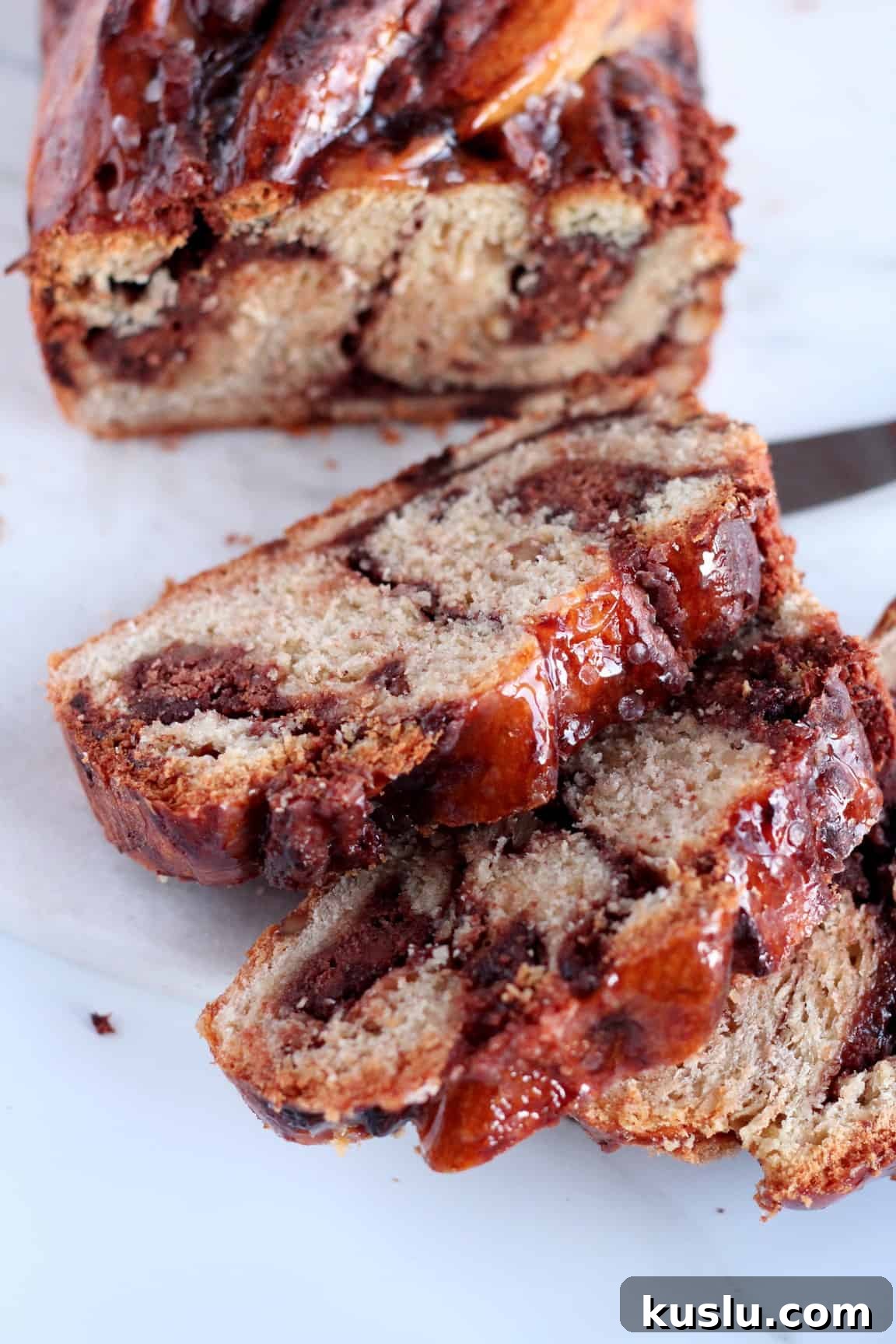three pieces of chocolate babka with almond filling