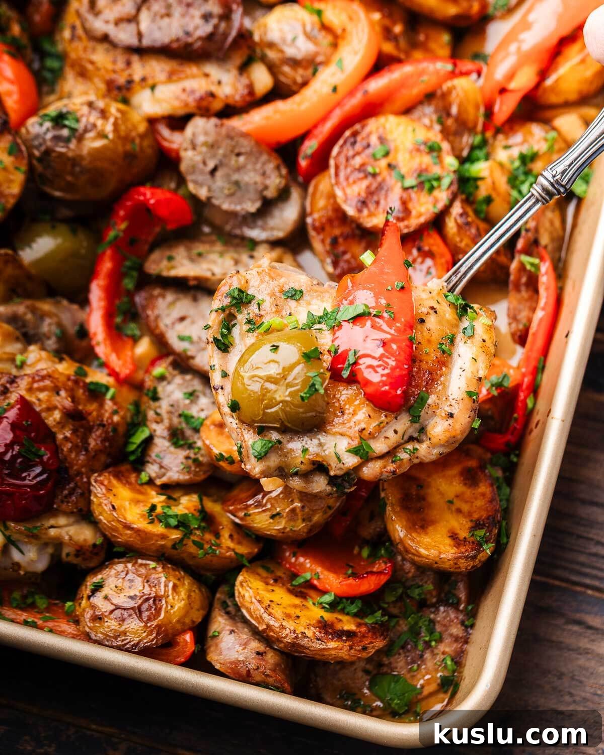 Savory Chicken Scarpariello Recipe: Zesty Italian Classic 7 Hands holding fork with piece of chicken over pan.