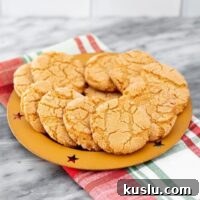 Peanut Butter Crackle Cookies: Crispy, Chewy Snack Recipe 2 peanut butter crackles on a plate