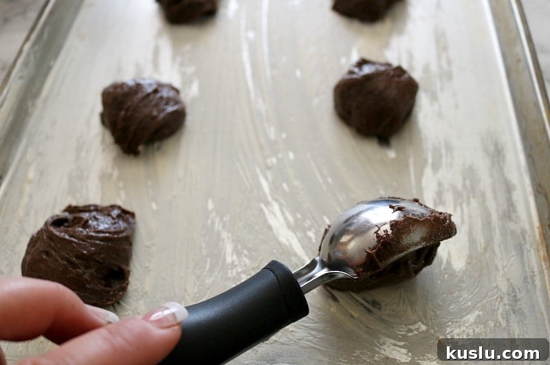 whoopie pie batter scooped on sheet pan. 