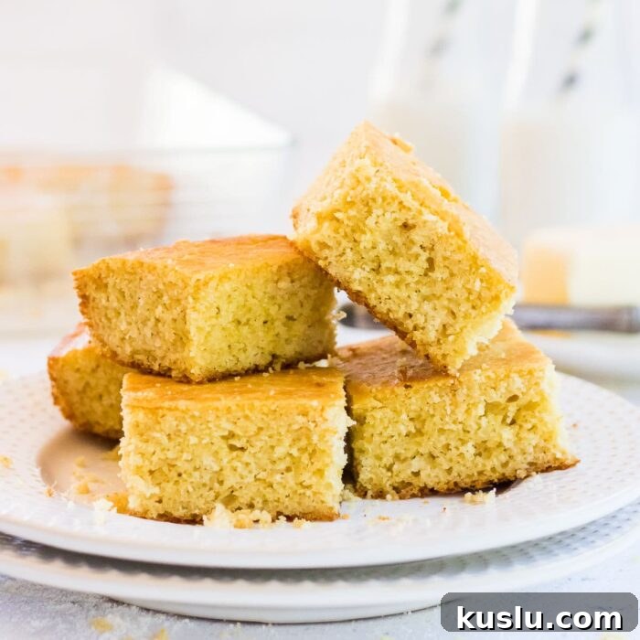 Stack of cut cornbread squares ready to be served.