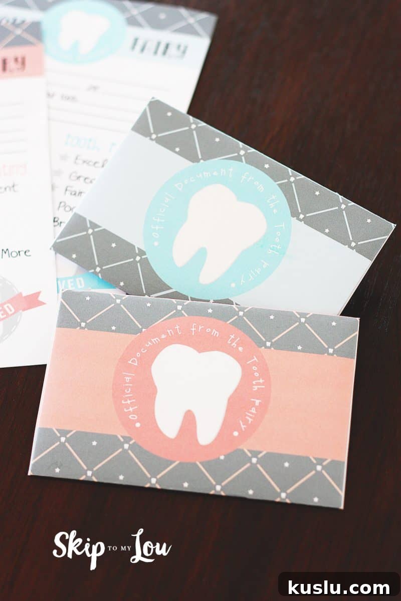 Printable Tooth Fairy Letter, Certificate & Tooth Report Kit 4 Close up of printable envelope with tooth on front in pink an blue for the Tooth Fairy Letter.