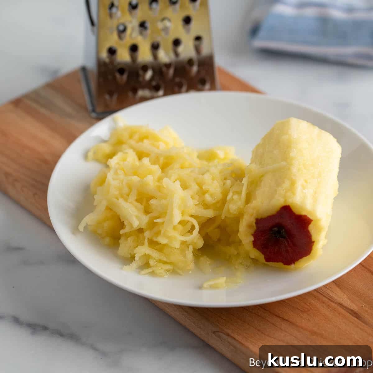 Shredded apple on a plate.