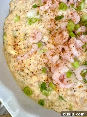 A baking dish with creamy shrimp and crab dip.