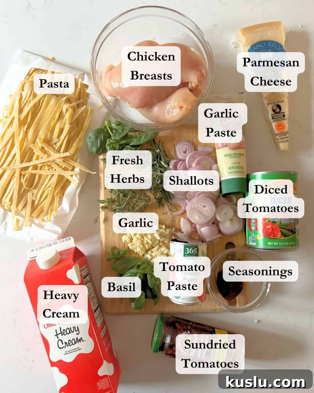 ingredients to make marry me chicken pasta in bowls on a white surface.