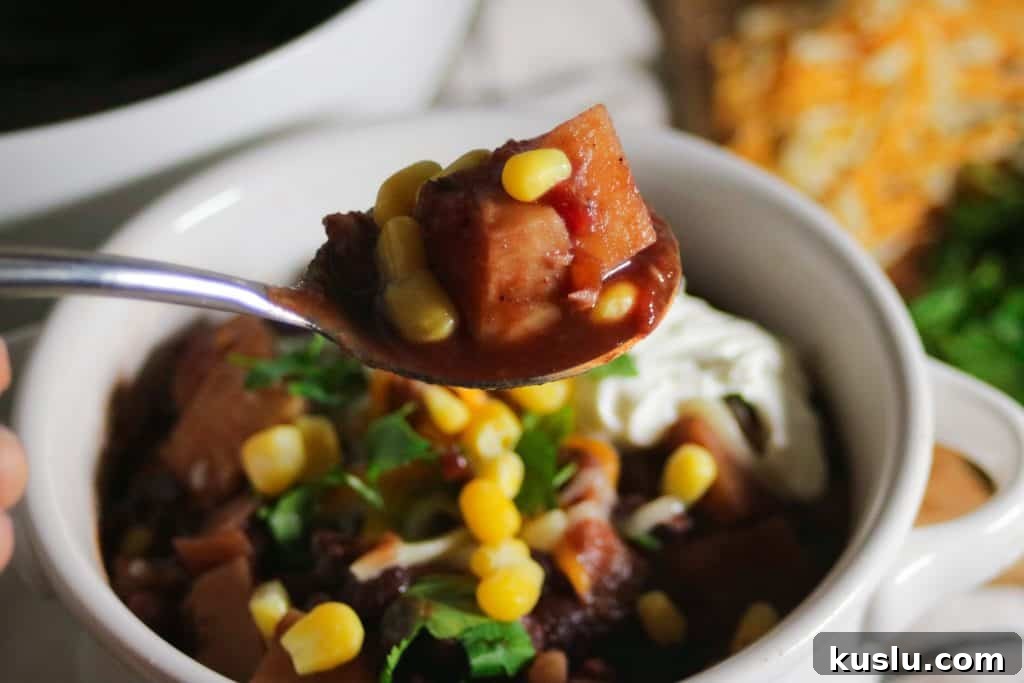 bowl of vegetarian chili with toppings