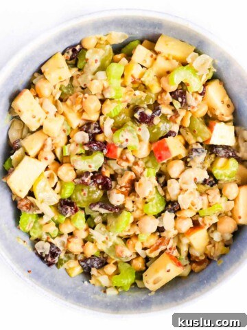 Mixed chickpea salad in a blue bowl.