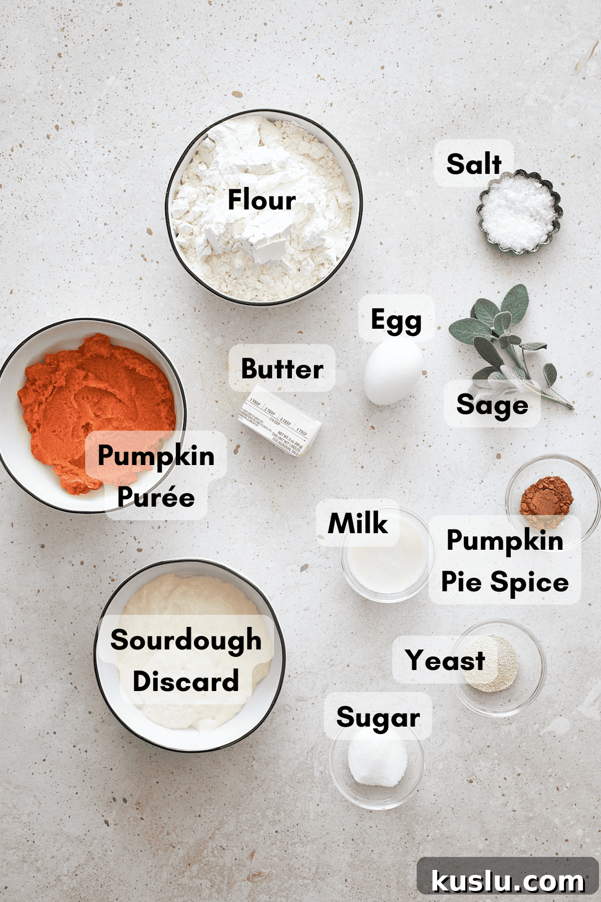 Ingredients for Sourdough Discard Pumpkin Dinner Rolls in small bowls.