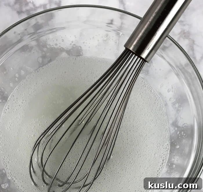 Whisking the homemade dish soap