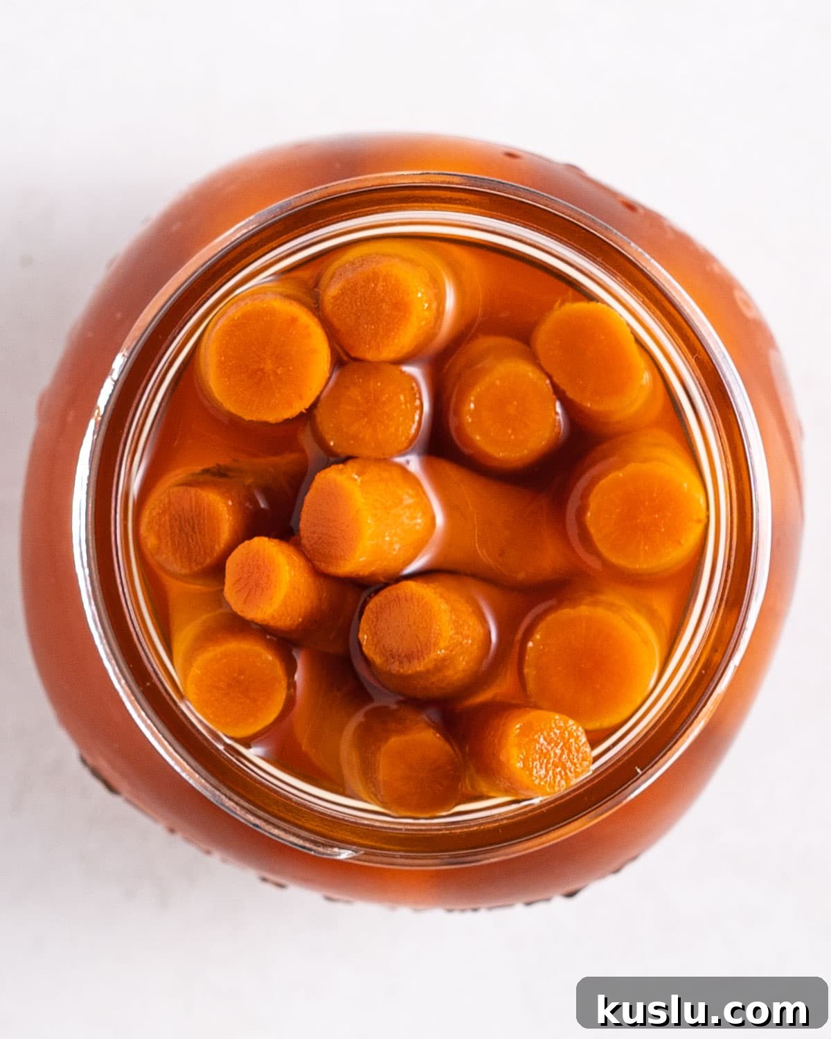 top view of yamagobo in pickling juice in a jar.