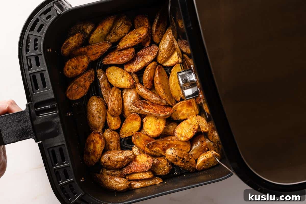 Crispy Air Fryer Fingerling Potatoes Recipe 10 cooked fingerling potatoes in air fryer basket
