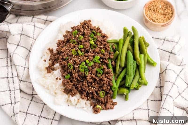 Simple Weeknight Dinner Recipes for Busy Families 14 Asian Ground Beef served on a bed of rice.