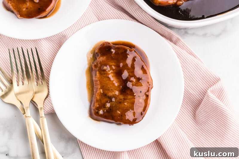 Simple Weeknight Dinner Recipes for Busy Families 15 Teriyaki Pork Chops served on a white plate.