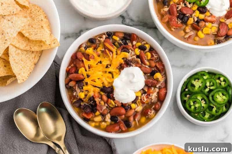 Simple Weeknight Dinner Recipes for Busy Families 22 7 Can Taco Soup served in a white bowl.