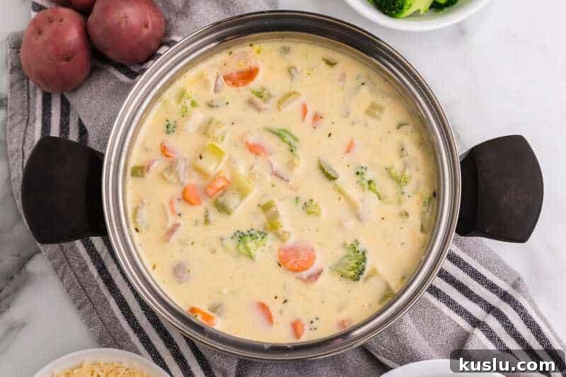 Simple Weeknight Dinner Recipes for Busy Families 23 Broccoli Potato Cheese Soup in the pot.