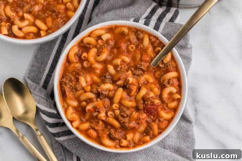 Simple Weeknight Dinner Recipes for Busy Families 24 Beef and Macaroni Soup served in a white bowl.