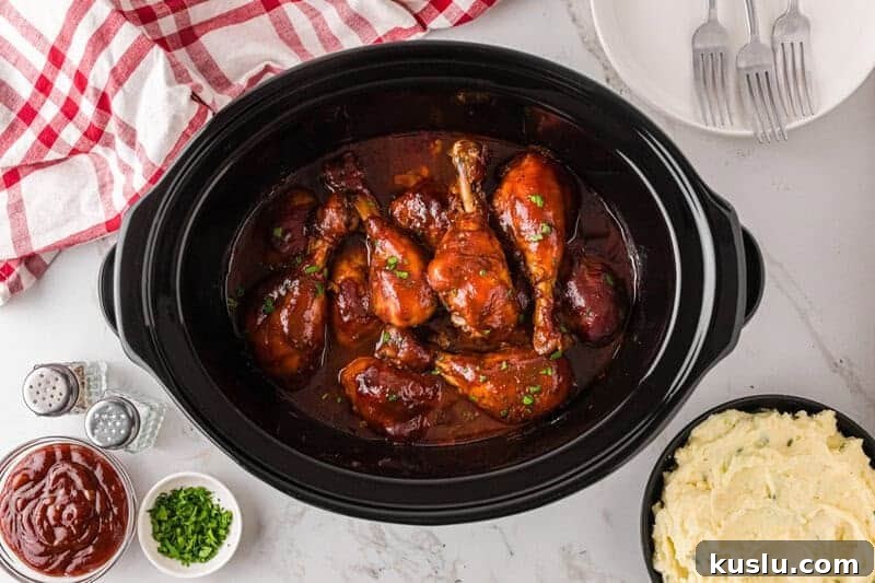 Simple Weeknight Dinner Recipes for Busy Families 10 top-down view of the slow cooker BBQ Chicken Drumsticks.