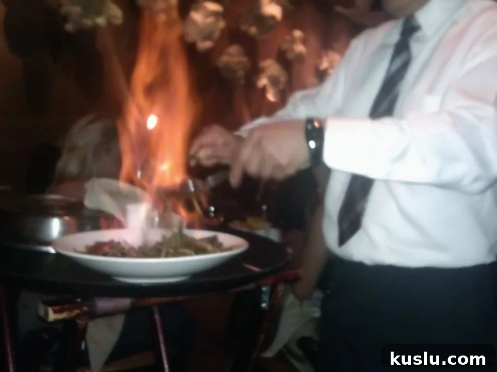 Chiles y cebollas flambeado tableside