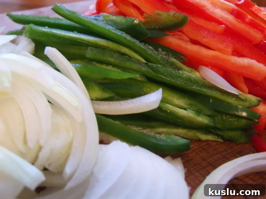 Onions, chiles and peppers cut into strips