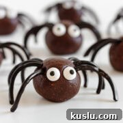 Halloween spider energy balls on a white surface.