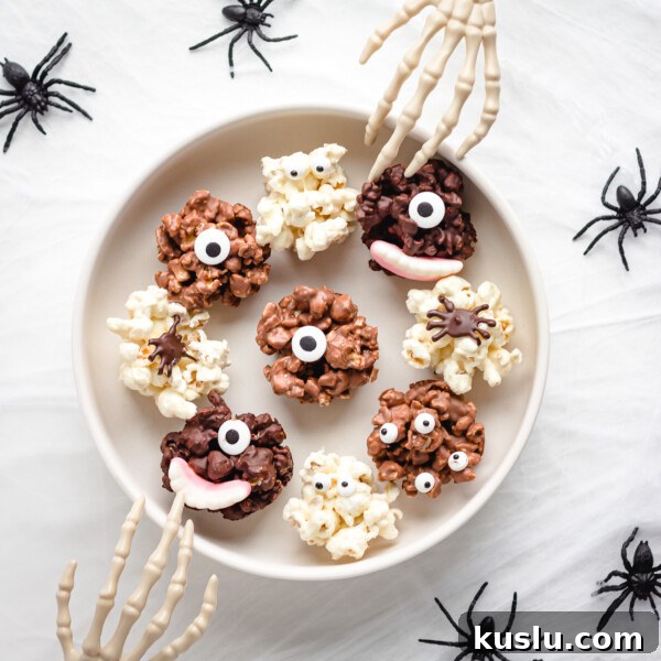 Serving bowl of chocolate Halloween popcorn balls with skeleton hands reaching in.