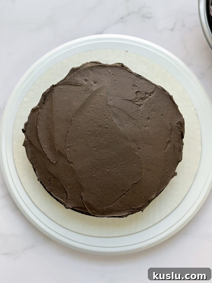 first layer of buttercream on cake.