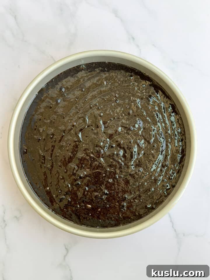 the cake in the pan before baking.