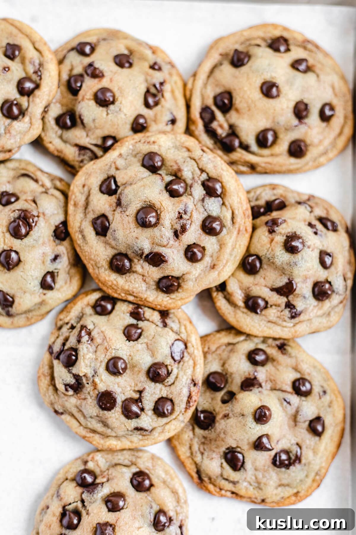 cookies piled together on a baking sheet
