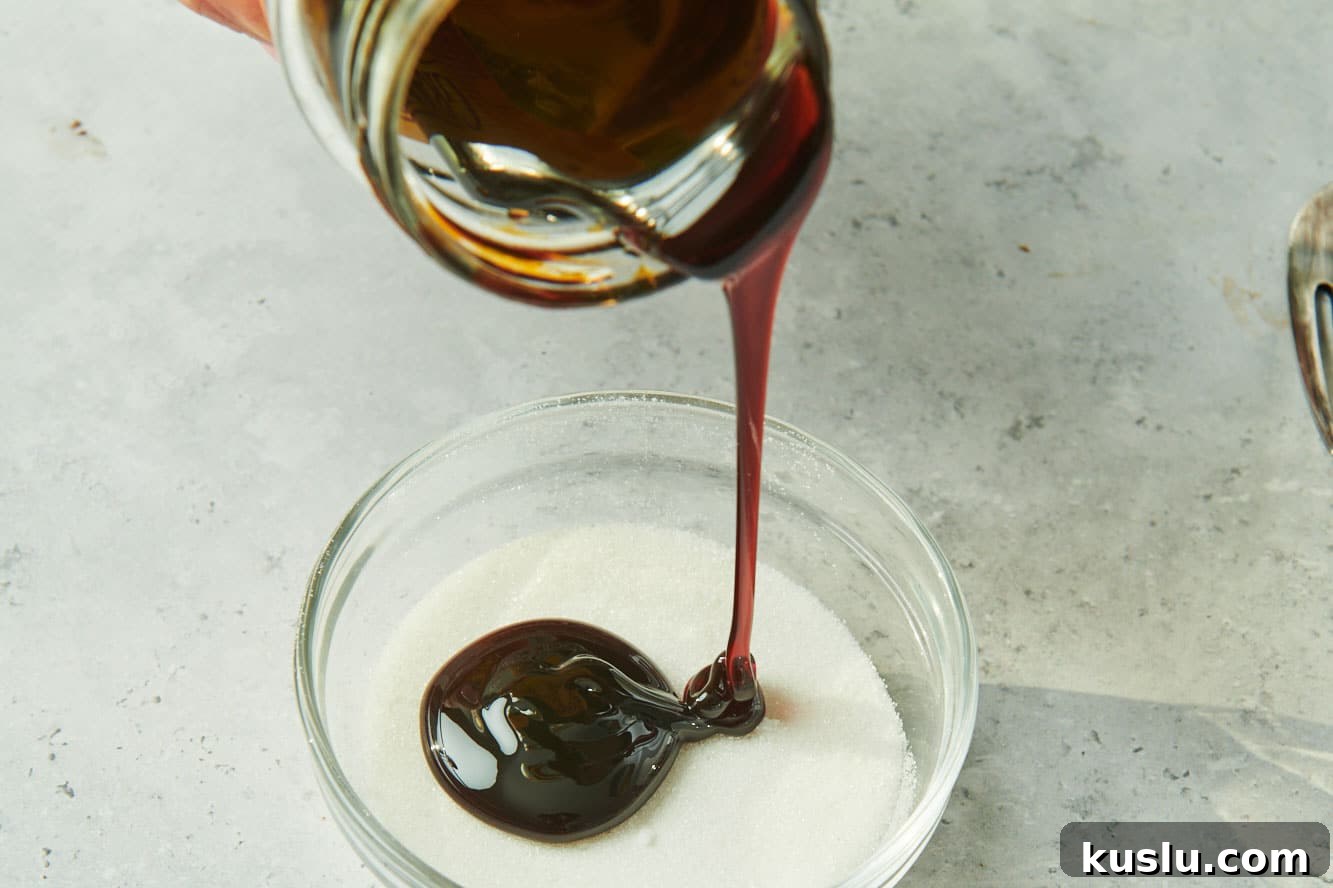Brown Sugar Substitute: Simple Homemade Alternatives and Tips 3 Pouring molasses from jar into bowl of white sugar.