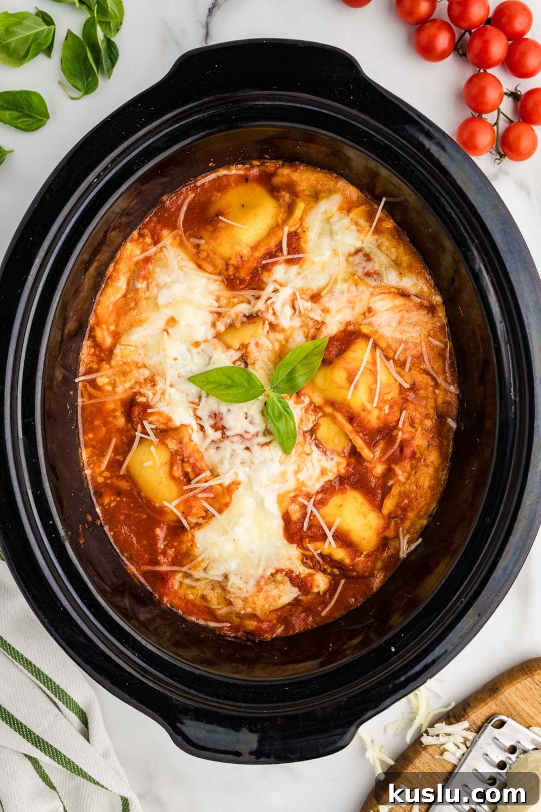 Slow Cooker Ravioli Lasagna: Comforting One-Pot Dinner 4 overhead view of black slow cooker with cooked ravioli lasagna