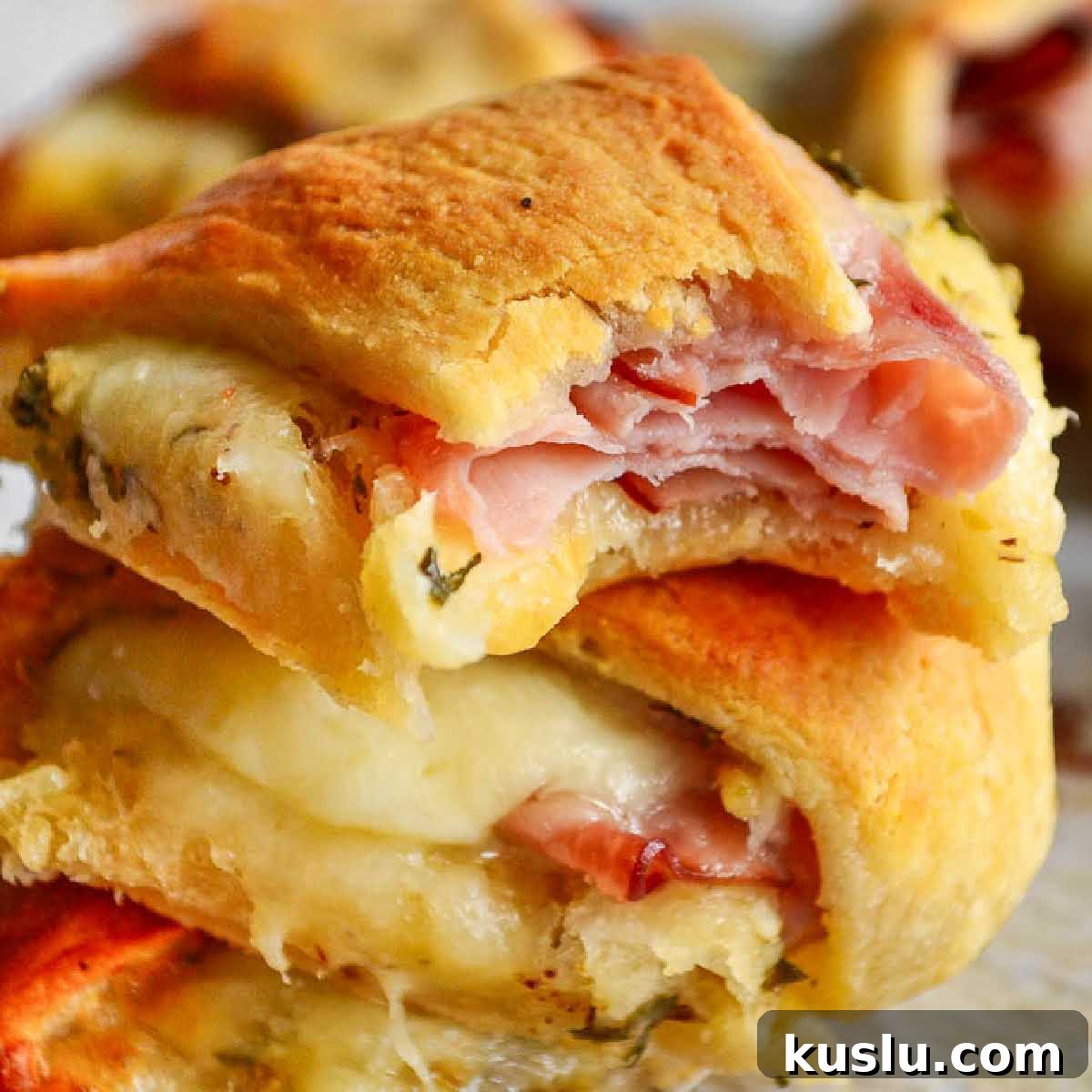 Close up of a stack of Ham and Cheese Crescent Ring slices.